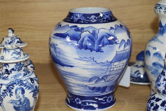 An Asian blue and white inverted pyriform jar and cover, a similar pair of smaller vases and two other items, H 25cm (largest)